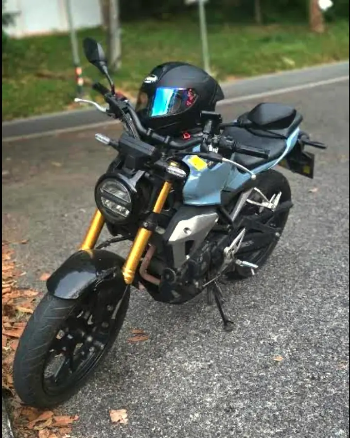 Honda CB150R with a helmet on the seat